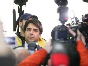 Jian Ghomeshi leaves College Park court on Wednesday, Nov. 26, 2014. (Veronica Henri/Toronto Sun)