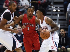Hawks guard Jeff Teague (right) dribbles the ball as Raptors guard Kyle Lowry defends during the first half at Philips Aren in Atlanta on Wednesday night. (Dale Zanine-USA TODAY Sports)