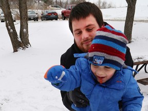 JOHN LAPPA/THE SUDBURY STAR
Aeden Dzubak, 3, builds a snowman with the help of his dad, Kris, on Saturday.