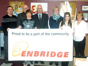 Enbridge Inc. is providing $20,000 a year for the next three years to help fund Wallaceburg District Secondary School's PACE (Partnership, Achievement, Cultural Awareness and Engagement) Program. The program assists at-risk students. A ceremony was held on Nov. 19 to acknowledge the donation. Ken O'Neil (PACE employee), Rob Lee (WDSS principal), Luke Benedict (WDSS student), Ken Hall (Enbridge), Cynthia Lockery (Enbridge), Catherine Dupick (WDSS student) and Cherrie Lalonde (PACE employee) pose for a picture following the ceremony.