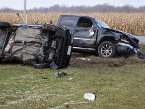 The driver of the car was airlifted to hospital with life threatening injuries after colliding with the pick-up truck at the intersection of Coldstream Road and Oxbow Drive in Komoka, Ontario on Thursday, November 27, 2014. The diver of the truck was not seriously injured. The license plates have been obscured at the request of police. (DEREK RUTTAN, The London Free Press)