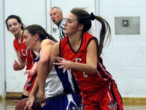 Woodstock Collegiate Institute Red Devil Ashley Wettlaufer, right, and Huron Park Huskies guard Siarra Stefan fight for control of a loose ball in the first half of their TVRA East Division Sr. girls' basketball playoff game Tuesday. WCI will host the annual captains/veterans All-Star game that features junior and senior girls from their respective basketball teams in the TVRA East Division play each other in a city vs. county set-up. (GREG COLGAN, Sentinel-Review)