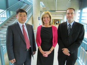 Ke Tian, vice-president of Jilin University-Lambton College in China, left, visited with officials at Lambton College Thursday, including president Judith Morris and Chris Slade, right, Lambton's dean of international studies. Jilin University and Lambton College have been partners since 1999, with more than 600 students currently enrolled in seven Lambton College programs offered at the university's campus in Changchun, China. (PAUL MORDEN, The Observer)