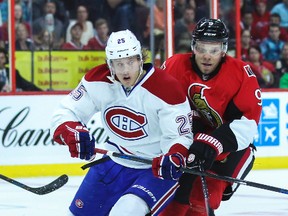 Ottawa Senators' Milan Michalek battles with Montreal Canadiens' Jacob De La Rose during NHL pre-season hockey action at the Canadian Tire Centre in Ottawa, Ontario on Friday October 3, 2014. Errol McGihon/Ottawa Sun/QMI Agency