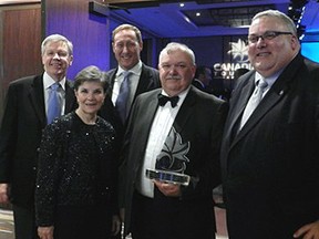 Elgin Military Museum executive director Ian Raven, second right, shares national travel award important people in the history of Project Ojibwa.  From left, Jim Hudson, Southwest Ontario Tourism Corp.; Catherine Raven, museum webmaster; Justice Minister Peter McKay; EML MP Joe Preston.
Contributed