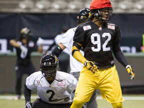 Hamilton Tiger Cats #2 Nic Grigsby (left) and #92 run drills during the team practice at the CFL's 102nd Grey Cup Festival in Vancouver, B.C. on Wednesday November 26, 2014. The Hamilton Tiger Cats will play the Calgary Stampeders for the Canadian football league championship title on Sunday, November 30.  Carmine Marinelli/QMI Agency