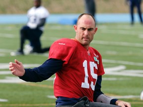 QB Ricky Ray stretches the team out while sipping on a coffee in the cool air as the Toronto Argonauts prepare for their CFL game in Montreal  On Sunday during CFL action in Toronto, Ont. on Thursday October 30, 2014. (Michael Peake/QMI Agency)