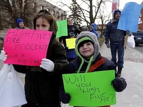 Parents and schoolchildren protest over city no-touch policy for crossing guards at City Hall in Peterborough, Ont., on November 28, 2014. (CLIFFORD SKARSTEDT/QMI Agency)