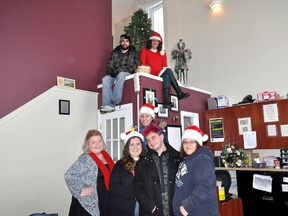 Amanda Kerrouch (bottom left), Terri King, Pam Johnston, Ryan Phelps, Maryellen Young, Dan Checkley (top left) and Silvia Langer get into the Christmas Spirit at The Unity Project on Dundas Street Nov. 28, 2014. The Unity Project is launching their annual Giving Season with opportunities to help the emergency shelter and transitional housing service throughout December. CHRIS MONTANINI\LONDONER\QMI AGENCY