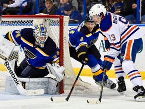 Ryan Nugent-Hopkins tries a wraparound on Blues goalie Jake Al;len in first-period action Friday in St. Louis. (USA TODAY SPORTS)