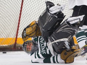 Liam Turnbull of the MTS Spartans almost stood on his head, but to no avail as the STA Flames dominated winning 4-0 in early season London District Senior Boys' hockey at Carling arena in London, Ont. on Friday November 28, 2014. 
Mike Hensen/The London Free Press/QMI Agency