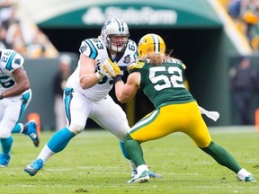 Carolina Panthers offensive lineman David Foucault blocks Green Bay Packers rusher Clay Matthews during NFL play this season. (JEFF HANISH/USA TODAY SPORTS)