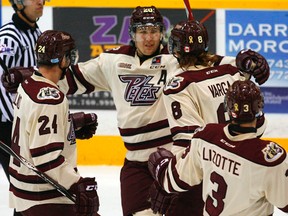 Peterborough Petes' Nick Ritchie, middle, celebrates a goal with Connor Boland (24), Steven Varga (8), and Cameron Lizotte against the Sault Ste. Marie Greyhounds'during second period OHL action on Thursday, November 20, 2014 at the Memorial Centre in Peterborough. (Clifford Skarstedt/Peterborough Examiner/QMI Agency)