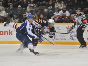 During an assault on the net, Cordell James of the Barrie Colts get tangled up with Austin Clapham of the Sudbury Wolves, during first period OHL action Saturday at the Barrie Molson Centre.
Mark Wanzel / QMI Agency