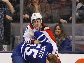 Korbinian Holzer of the Maple Leafs picks up his team's fifth fighting major of the season on Nov. 29, 2014, during a scrap with Tom Wilson of the Washington Capitals at the Air Canada Centre. (STAN BEHAL/Toronto Sun)