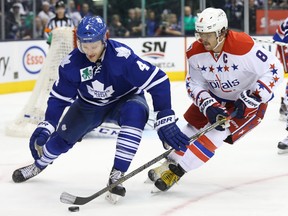 Maple Leafs defenceman Cody Franson (left) tries to fend off Capitals captain Alex Ovechkin at the ACC on Saturday night. (Reuters)
