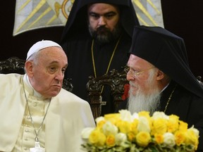 Pope Francis speaks with Ecumenical Patriarch Bartholomew I after they signed a joint statement at St George church, the principal Greek Orthodox cathedral, in Istanbul November 30, 2014. REUTERS/Filippo Monteforte/Pool