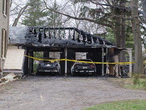A garage, two vehicles and a shed were destroyed by fire at 1135 Riverside Dr. in London Friday. DEREK RUTTAN/ The London Free Press /QMI AGENCY