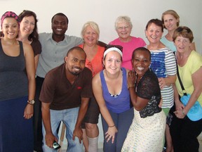 Participants in Rayjon's latest awareness trip pose with their interpreter in Haiti. The group spent a week visiting with Haitian children and parents, even marking Flag Day with them. SUBMITTED PHOTO