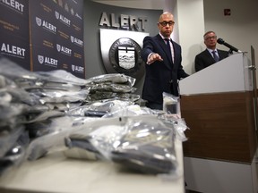 The Alberta Law Enforcement Response Team's Darcy Strang speaks to the media about a $750,000.00 drug bust at ALERT headquarters on October 15, 2014.  Perry Mah/Edmonton Sun/QMI Agency