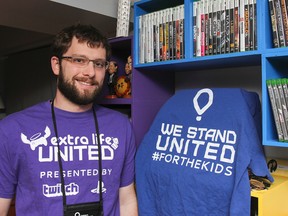 Ryan Bosman raised more than $10,000 for his charity of choice, Sick Kids Hospital in Toronto, in the first annal Extra Life United gaming tournament in Florida in November. Bosman, seen here in his home, outlasted 72 other gamers to place fourth overall at the charity event. (Julia McKay/The Whig-Standard)