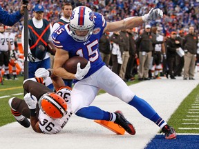 Buffalo Bills wide receiver Chris Hogan (15) scores a touchdown as Cleveland Browns defensive back K'Waun Williams (36) defends during the second half at Ralph Wilson Stadium on Nov 30, 2014 in Orchard Park, NY, USA. (Kevin Hoffman/USA TODAY Sports)
