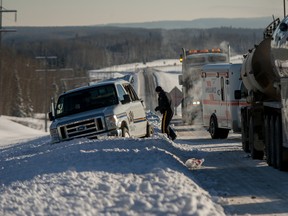 Whitecourt RCMP, fire and EMS respond to the scene of a motor vehicle collision involving an Alberta Correctional Services transport van and a semi-tractor trailer on in the westbound lanes of Highway 43 on Sunday in Whitecourt. (Adam Dietrich/QMI Agency)