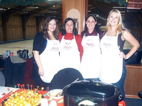 The Eternity's Touch chili cooking team, which nicknamed themselves Chili, Chili, Bang Bang; was named the People's Choice winners at the 10th annual United Way Chili cook-off held on Saturday, Nov. 29 at the Sydenham Community Curling Club. Some of the team members included, from left, Amy Griffin, Tracey Jardine, Chantelle Bilodeau and Chelsea Bilodeau.