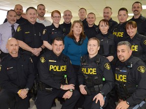 Several officers from all over Huron and Perth counties took some time out last week to learn more about how to assist residents with mental health issues in their communities. Here, the 18 officers stand with trainer Sarah Burtenshaw after completing the three-day course presented by the Huron Health Unit in Clinton. (WHITNEY SOUTH/HURON EXPOSITOR)