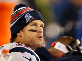Patriots quarterback Tom Brady reacts on the bench during the fourth quarter against the Packers in Green Bay, Wisc., on Sunday, Nov. 30, 2014. (Christian Petersen/Getty Images/AFP)