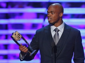Minnesota Vikings running back Adrian Peterson accepts the award for the NFL Offensive Player of the Year during the NFL Honors award show in New Orleans, Louisiana February 2, 2013. (REUTERS/Jeff Haynes)