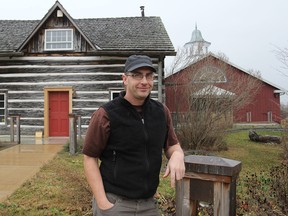 Curator Tom Riddolls stands in front of the MacLachlan Woodworking Museum, at Grass Creek Park, which will be holding its annual WinterLight celebration. (Michael Lea/The Whig-Standard)