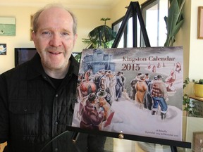 Publisher Bob Hilderley shows the 2015 Kingston calendar he has produced, featuring artwork that was chosen to illustrate the personality of the city. (Michael Lea/The Whig-Standard)