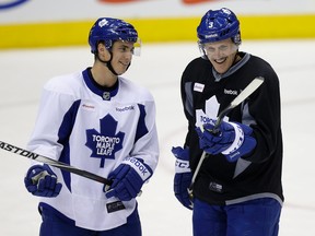 Tyler Bozak (left) and Dion Phaneuf have a laugh at Leafs practice on Monday. (Craig Robertson/Toronto Sun)
