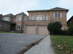 Aleeya Raza, 28, was found in the driveway of this Norbury Drive home in Markham Friday, Nov. 28, 2014. (Stan Behal/Toronto Sun)