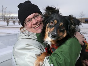 Kelly Malanik and her service dog pal Mia in Calgary, Alta., on Monday Dec. 1, 2014. 
Mike Drew/Calgary Sun/QMI Agency