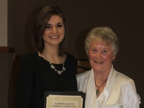 Emily Opthof, a second year student at the University of Western Ontario, received her scholarship from Women's Institute member Ann McGugan