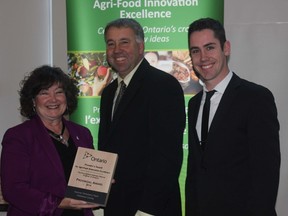 Cambridge MPP Kathryn McGarry presents Rudy and Will Heeman of Heeman Strawberry Farm with the Premier's Award for Agri-Food Innovation Excellence. The Heemans developed a software program that enables them to trace every berry sold back to the farm, field, picker and harvest time. As well as engaging customers the system also enhances food security.