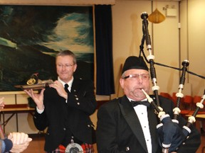 Pipe Sgt. Terry Mills and Ivan Bryce parade the haggis in front of a famished group of Scotsmen at Petrolia's 144th annual St. Andrew's Society dinner.
CARL HNATYSHYN/SARNIA THIS WEEK/QMI AGENCY