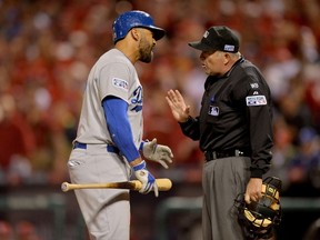 Matt Kemp #27 of the Los Angeles Dodgers argues with home plate umpire Dale Scott after getting called out in the ninth inning against the St. Louis Cardinals in Game Three of the National League Division Series at Busch Stadium on October 6, 2014 in St Louis, Missouri.  Michael Thomas/Getty Images/AFP