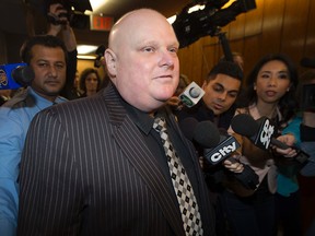 Councillor Rob Ford arrives for the first council meeting of the term at Toronto City Hall on Tuesday December 2, 2014. (Dave Abel/Toronto Sun)