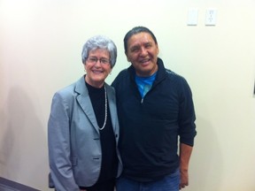 The Support for Suicide Loss event happens annually on the weekend before U.S. Thanksgiving. Left, the Memory Table is dotted with candles to be lit in memory of those lost to suicide. Right, Judy Kesanko stands with Elder Wilson Bearhead, who led a smudge ceremony and told attendees Aboriginal stories and beliefs. - Photo Courtesy CSPP