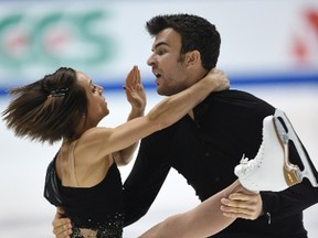 Meagan Duhamel and Eric Radford of Canada perform during the pairs free skating at the NHK Trophy ISU Grand Prix figure skating 2014 in Osaka on Nov. 29, 2014.