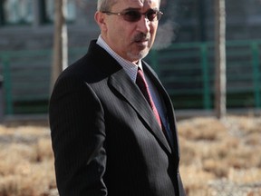 Optometrist Bassam Aabed stands outside the Ottawa court house Tuesday, Dec. 2,  2014. (Tony Caldwell/Ottawa Sun)