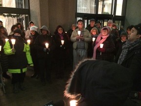 Candlelight vigil held Dec. 2, 2014, at the East York apartment building where Zahra Abdille, 43, and her boys, Faris, 13, and Zain, 8, were found slain.