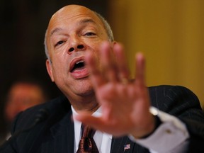U.S. Department of Homeland Security Secretary Jeh Johnson responds to Rep. Patrick Meehan (R-PA) as the two men debate the legality of President Obama's executive action on immigration during a House Homeland Security Committee hearing on Capitol Hill in Washington, December 2, 2014. REUTERS/Jim Bourg