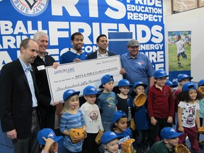 Kingston Mayor Bryan Paterson, left, and Toronto Blue Jays outfielder Dalton Pompey, centre, were on hand Tuesday as the Jays Care Foundation donated $150,000 to help with the renovation of the Boys & Girls Club of Kingston’s West End Community Hub. (Patrick Kennedy/The Whig-Standard)
