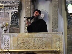 A man purported to be the reclusive leader of the militant Islamic State Abu Bakr al-Baghdadi has made what would be his first public appearance at a mosque in the centre of Iraq's second city, Mosul, according to a video recording posted on the Internet on July 5, 2014, in this file still image taken from video. The Lebanese army detained a wife and a son of Islamic State leader Abu Bakr al-Baghdadi as they crossed from Syria in recent days, security officials said on Tuesday.  REUTERS/Social Media Website via Reuters TV