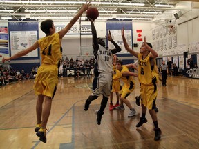 All-star guard Mark Tarauna goes in for a layup as the host St. Francis Xavier Rams downed Lloydminster 79-40 on the first day of the Mike Dea Memorial high school hoops tournament.