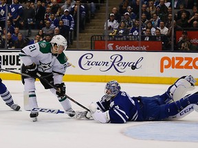 Maple Leafs goaltender Jonathan Bernier sprawls out on the ice to poke check Antoine Roussel of the Dallas Stars last night at the Air Canada Centre. Bernier made 35 saves for the victory. (Michael Peake/Toronto Sun)